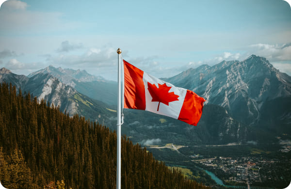 Drapeau du Canada dans les Rocheuses, illustrant s’expatrier au Canada avec Grospiron