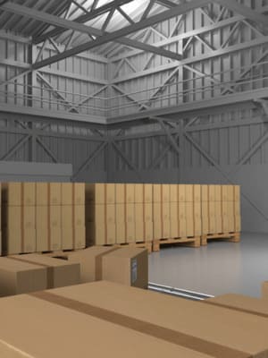 Entrepôt rempli de cartons, symbolisant le service de garde-meubles sécurisé de Grospiron